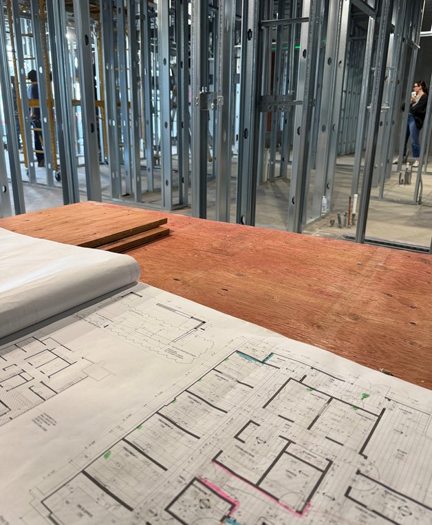 Interior metal framing and rough-in during the office construction phase